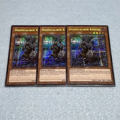 Yugioh Doomcaliber Knight SBC2 1st Edition Secret Rare 3 Card Set Lightly Played - Image 1 of 2