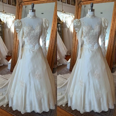 Vestidos de novia victorianos satinados mangas largas cuello alto tren de barrido vestidos de novia Foto 1 de 4