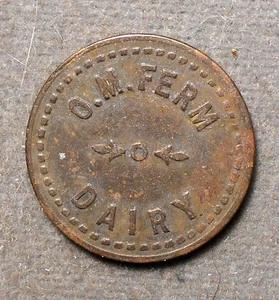 (Rockford IL), O.M. Ferm Dairy Good For 1 Pint Of Milk. Brass, 21mm, TC-20688 - Picture 1 of 2