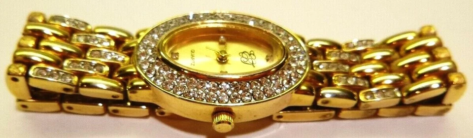 Reloj pulsera EJ Ernest Jones para mujer, tono dorado con cristales blancos, moda  Foto 1 de 4