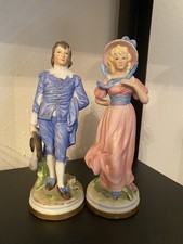 pinky and blue boy figurines