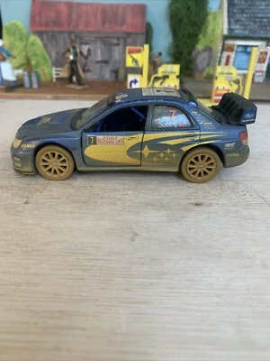 Subaru Impreza WRC 2007 Muddy - Kinsmart Pull Back & Go - Escala 1:36 Foto 1 de 4
