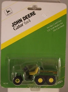 Ertl Maßstab 1:32 #5748 John Deere Gator 6x4, Ausgabe 1995 (UNPERFEKTE VERPACKUNG) - Bild 1 von 3