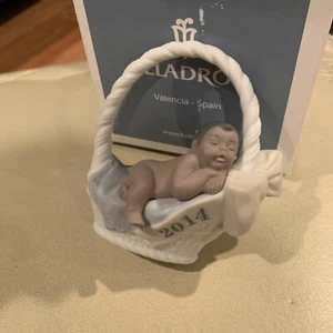 Lladro Porcelain baby boy in basket 2014 dark skin  - Picture 1 of 5