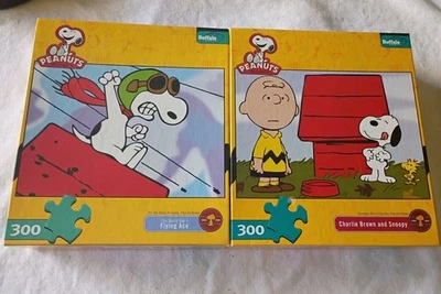 Charlie Brown and Snoopy Buffalo 300 Piece Jigsaw Puzzle Peanuts Lot Of 2 - Image 1 of 4