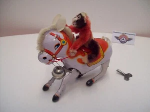 Blechspielzeug "Pferd mit Affe", springend durch Aufziehwerk, 80er Made in China - Picture 1 of 5