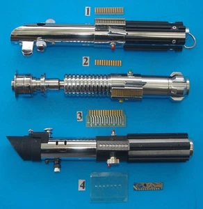 PIEZAS DE DECORACIÓN ABRAZADERA SABLE DE LUZ WARS. - Imagen 1 de 12