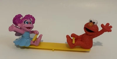 Taller de sésamo panadería artesanías Elmo Zoe Teeter Totter ver-sierra figura tapa de pastel Foto 1 de 4