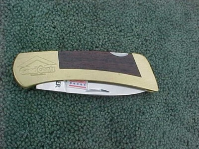 Navaja de Bolsillo GERBER Portland O EE. UU. Publicidad BUENOS CENTAVOS con Marco de Latón y Madera Foto 1 de 4