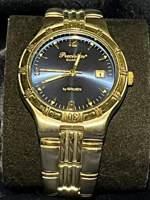 Gruen - Reloj de vestir de precisión para hombre de dos tonos esfera azul plateado con acento dorado Foto 1 de 4
