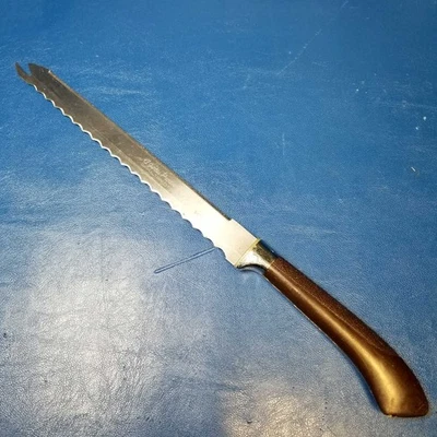 Cuchillo de pan dentado vintage Ginsu Product mango quirúrgico de acero inoxidable marrón Foto 1 de 4