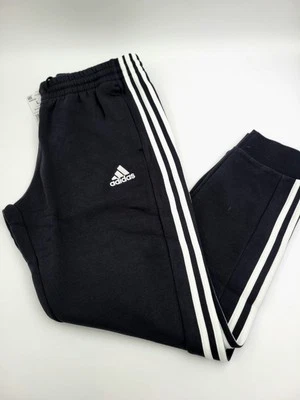 Pantalones Adidas Essentials para hombre polar 3 rayas puño cónico negros L-XL-2XL IB4030 Foto 1 de 4