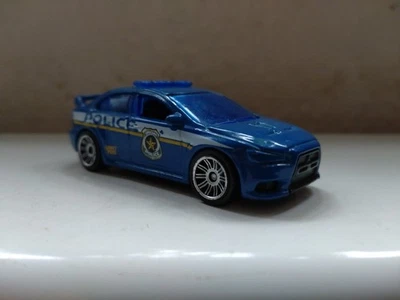 MATCHBOX 2010 MITSUBISHI LANCER EVOLUTION X POLICE MB808 1:62 #375 - Image 1 of 4