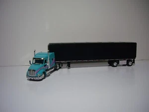 DCP FIRST GEAR 1/64 TEAL PETE 579 WITH SLEEPER AND SIMULATED ROLL TARP TRAILER - Picture 1 of 12