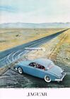 1960 JAGUAR 3.8 Blue Luxury Sports Sedan Driving on Lonely Highway Vintage Ad