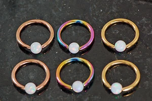 Par de anillos cautivos de ópalo oro arco iris oro 16G 5/16" (8 mm) de diámetro con ópalo de 3 mm - Imagen 1 de 9