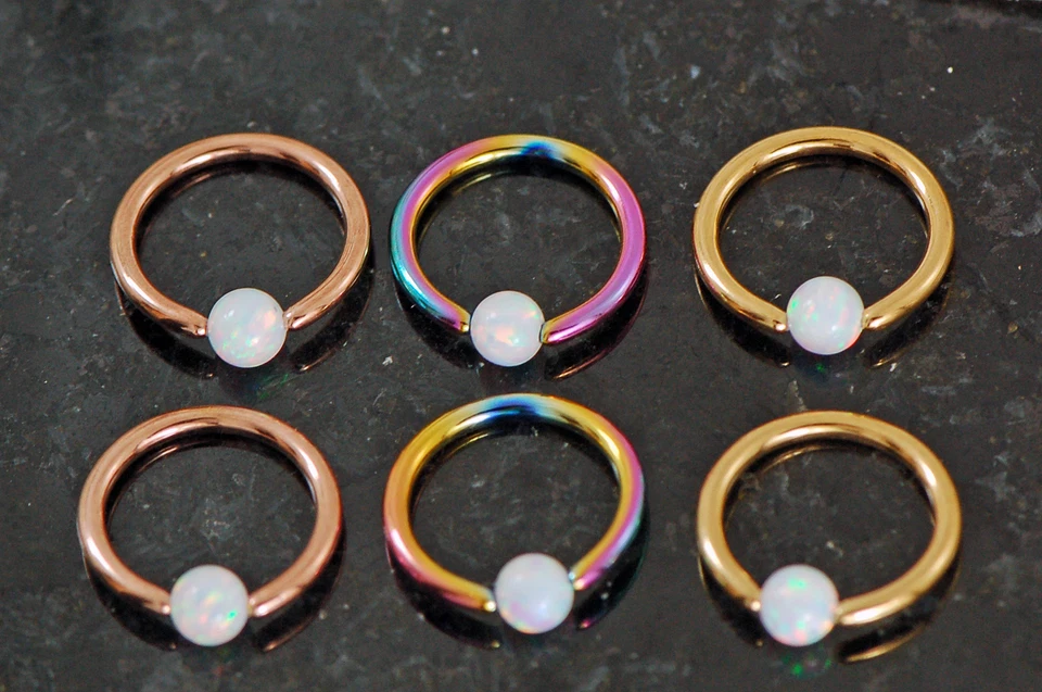 Par de anillos cautivos de ópalo de oro rosa arco iris 16G 5/16" (8 mm) de diámetro con 3 mm  Foto 1 de 4