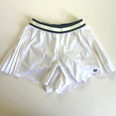 Pantalones cortos de tenis Wilson para niñas plisados laterales forrados blancos pequeños (7-8) Foto 1 de 4