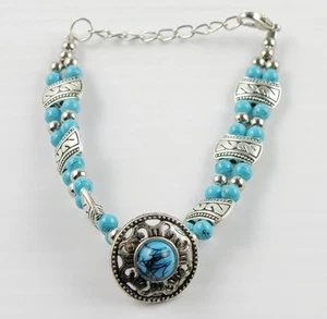 Silberfarbenes Perlenarmband mit türkisen Steinen größenverstellbar - Bild 1 von 9