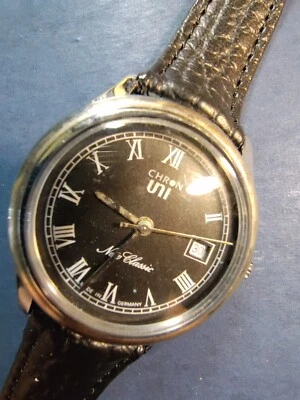 Reloj para hombre UniChron marca Ruhla calibre 24-33 esfera negra fecha números romanos Foto 1 de 4