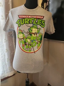 NUEVO CON ETIQUETAS Camisa Tortugas Ninja Adolescentes Mutantes Para Hombres Pequeña Gris Manga Corta Retro - Imagen 1 de 2