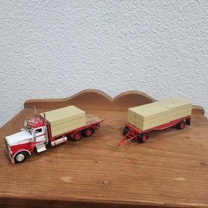 Tonkin/Truck n Stuff 1/53 Scale Peterbilt 388 Semi Flatbed w/Trailer & Load - Picture 1 of 9