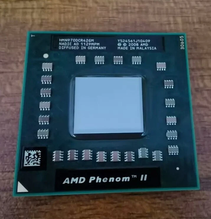 Procesador CPU original AMD Phenom II N970 2,2 GHz cuatro núcleos (HMN970DCR42GM) Foto 1 de 4