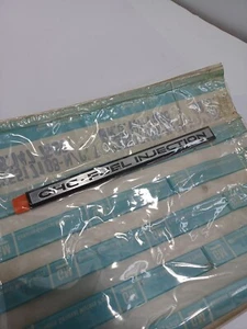 NOS OEM 1983-86 Buick J Body Fender Trim "OHC FUEL INJECTION" GM 25517108 - Picture 1 of 2