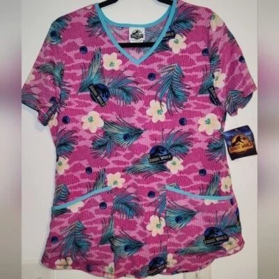 Jurassic World Dominion Scrub Top V-Neck Short Sleeve Pockets Pink Teal S - Image 1 of 4