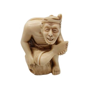 Netsuke Man Resting On Log Holding Foot - Picture 1 of 7