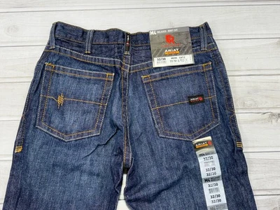Pantalones de mezclilla Ariat FR para hombre azules resistentes al fuego gato 2 M4 corte bota relajado elige la talla Foto 1 de 4
