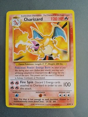 Pokémon Trading Card featuring Charizard, card number 4/102 from the Base Set - Image 1 of 3