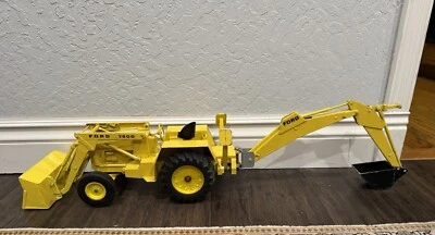 VINTAGE YELLOW ERTL/FORD 755A TRACTOR/BACK HOE - Image 1 of 4