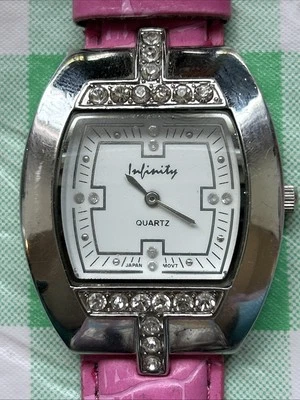Reloj de cuarzo para mujer Infinity tono plata correa rosa Foto 1 de 4
