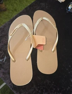 Havaianas Slim Sparkle Gold Flip Flops Glitter Shine Slim Straps ALL SIZES - Picture 1 of 5