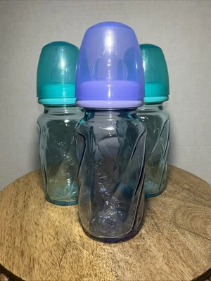 Paquete de 3 botellas de vidrio Evenflo ventiladas Plus de 4 oz verde azulado y púrpura Foto 1 de 3
