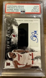 PRECIOUS ACHIUWA 2020-21 ORIGINS RPA PARCHE DE NOVATO AUTÓGRAFO RC AUTOMÁTICO/99 PSA 9/10 - Imagen 1 de 2