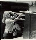 1973 Press Photo Lane Tech bat girl Joyce Newman sorts bats out at Comiskey Park