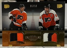 ERIC LINDROS / TYE McGINN 2013-14 Panini Dominion TIME WARP Dual Patch 35/50