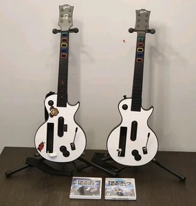 Pair Wii GUITAR HERO Les Paul GIBSON CONTROLLERS + Stands + 2 Games RockBand 1&2 - Picture 1 of 22