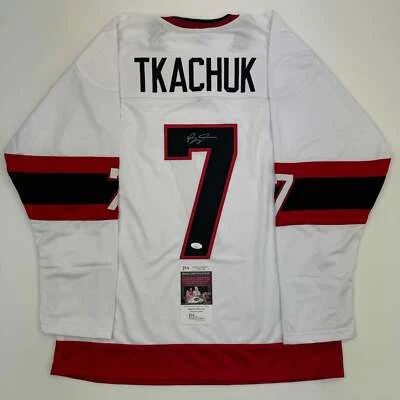 Autographed/Signed Brady Tkachuk Ottawa White Hockey Jersey JSA COA - Image 1 of 4