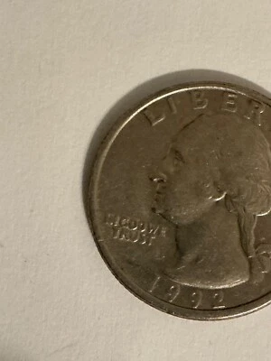1992 p quarter error.  In Cod We Trust. Filled in A in America - Image 1 of 4