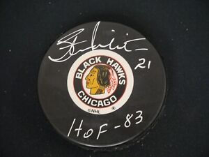 STAN MIKITA SIGNED CHICAGO BLACKHAWKS TEAM PUCK INSCRIBED "HOF 83" WITH JSA COA