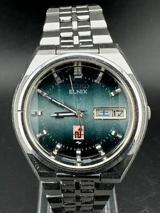 1983 Seiko Elnix Herren Day Date Eng/Kanji blaues Zifferblatt Quarzuhr 37mm 0703-6020 - Bild 1 von 11