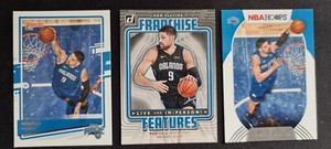 2020-21 Nikola Vucevic Donruss #3 and Franchise Features #22 and Hoops #80