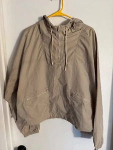 Adult NWOT "Champion" tan, hooded partial zipped windbreaker. Size Lalrge - Picture 1 of 2