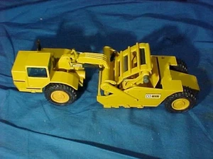 Raspador elevador juguete escala 1:50 NZG con Alemania CATERPILLAR 1970 - Imagen 1 de 3