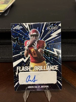 2021 Leaf Flash•Flash of Brilliance-Auto-NavyBlue Amon Ra St. Brown-WR 28/75 - Imagem 1 de 2