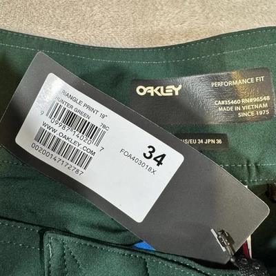 Pantalones cortos Oakley Triangle Board Hydrolix para hombre talla 34 verde Foto 1 de 4