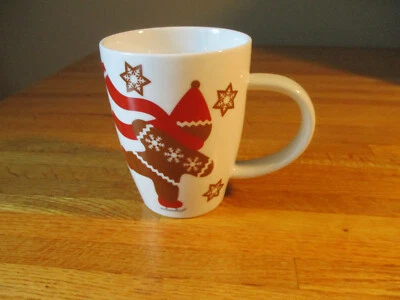 Taza de café patinaje sobre hielo de invierno vacaciones hombre pan de jengibre caja y barril Foto 1 de 4